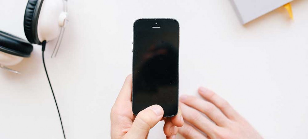 Photograph of hand holding mobile phone